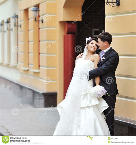 Bride And Groom Posing In An Old Town Wedding Couple