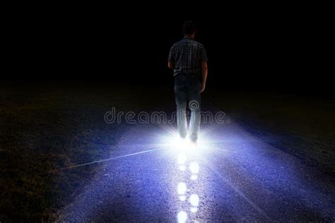 Man Walking With Light Foot Prints In Darkness Stock Photo Image Of