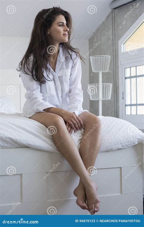 Beautiful Brunette In A White Shirt Posing On A Bed Stock Image Image Of Years Waking 96870123