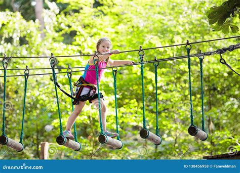 Child In Adventure Park Kids Climbing Rope Trail Stock Photo Image