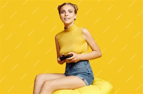 Premium Photo Portrait Of Gorgeous Happy Blonde Gamer Girl Playing