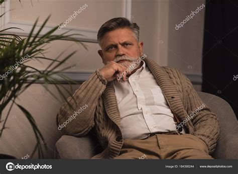 Handsome Senior Man Sitting Armchair Looking Camera Stock Photo By