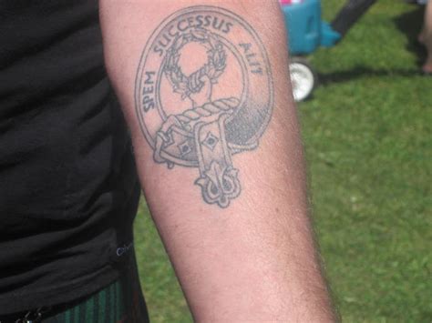 Nice family crest like little shield with snake tattoo on foot. 68th FERGUS SCOTTISH FESTIVAL - 2013