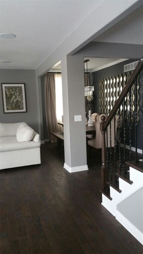 Stylish Gray Walls And Dark Wood Floors For Your Living Room