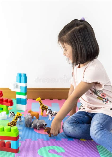 Little Girl Playing With Colorful Toy Blocks Construction Blocks Top