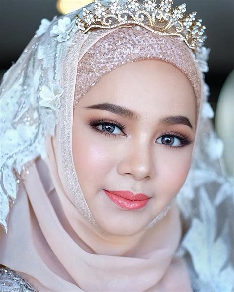 image may contain 1 person closeup muslimah wedding wedding hijab hijab style dress bridal