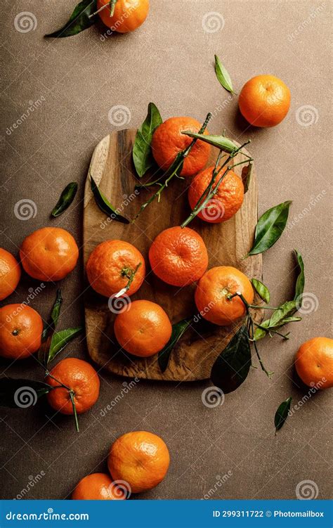 Mandarin Oranges Clementines Or Tangerines With Leaves On A Dark