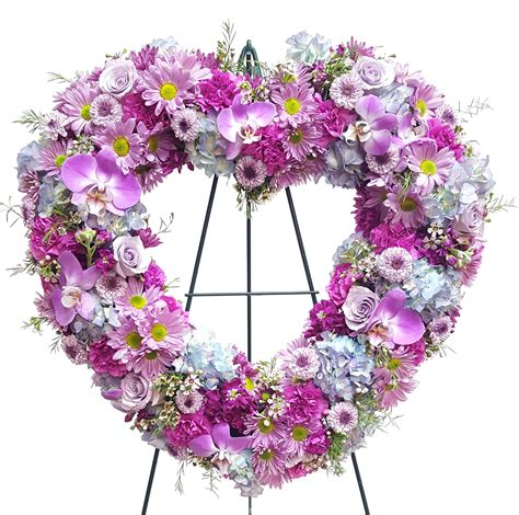 Blue open heart funeral flowers. lavender purple and blue funeral heart @laganaflorist ...