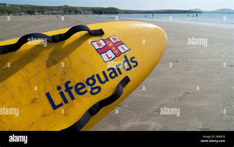 Lifeguards Rnli Logo Sign On Surfboard At Whitesands Bay Pembrokeshire