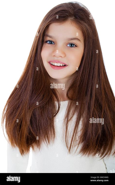Portrait Of A Charming Little Girl Smiling At Camera Isolated On White