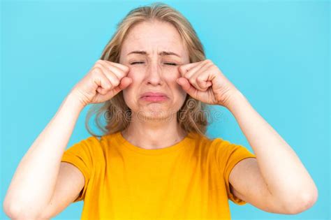 Studio Portrait Of Crying Upset Woman Feeling Lonely And Unhappy Stock