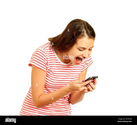 the girl screams into the phone loud conversation emotional girl isolated on white background