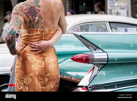 Vintage Car Festival Golden Oldies Tattooed Woman Beside The Tail