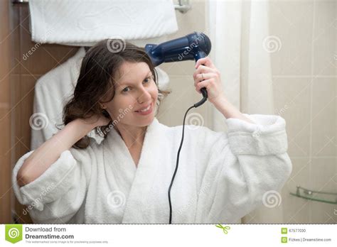 Young Woman Blowing Her Hair With Hairdryer Stock Photo Image Of