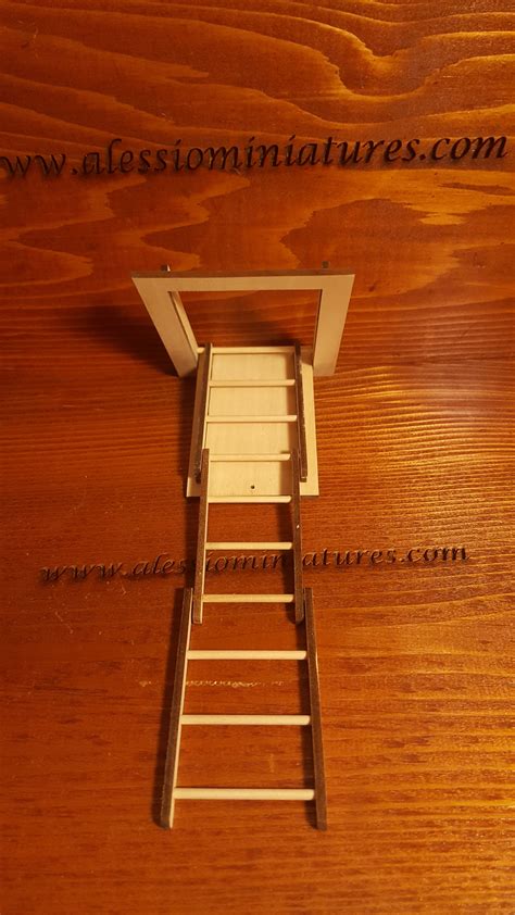 A Miniature Ladder Is Sitting On Top Of A Wooden Table