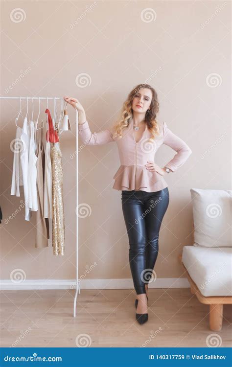 Beautiful Woman At The Rack With Women S Clothes Stock Image Image Of