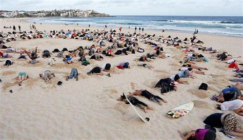 400 People Bury Heads In The Sand To Protest Australias Stance On