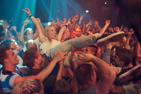 Premium Photo Own The Night Cropped Shot Of A Woman Crowd Surfing At