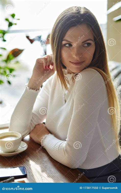 Beautiful Attractive Business Woman Drinks Cofee In The Cafe Stock