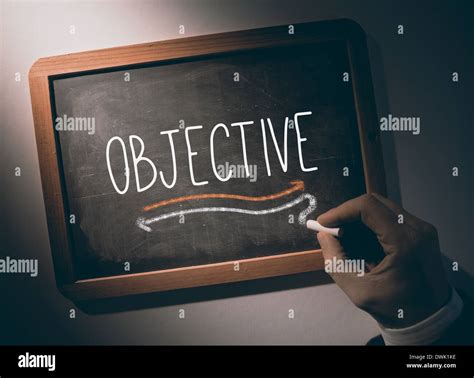 Hand Writing Objective On Chalkboard Stock Photo Alamy