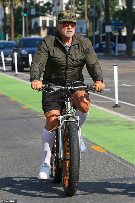 Arnold Schwarzenegger 74 Dons Knee High Bright White Socks For A Bike