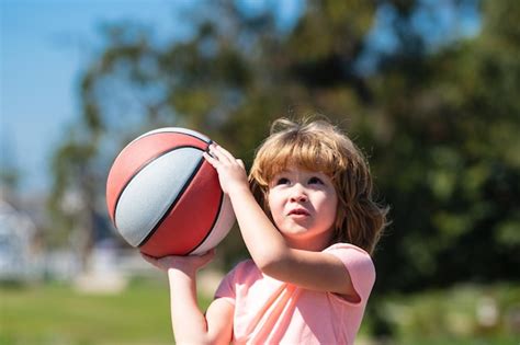 Premium Photo Kid Playing Basketball Child Boy Face Preparing For