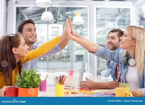 Cheerful Young Colleagues Are Working With Joy Stock Photo Image Of