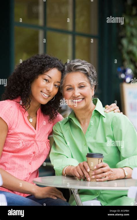 African American Mother And Adult Daughter Hugging Stock Photo Alamy