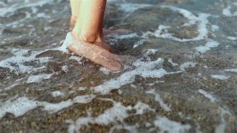 slow motion closeup barefoot female legs on beach with rolling waves stock video video of