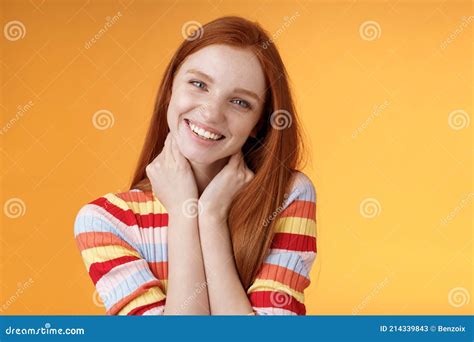 Silly Enthusiastic Attractive Redhead Blue Eyed Girl Tilting Head Touching Neck Flirty Smiling