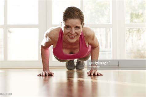 Germany Duesseldorf Mature Woman Doing Push Ups At Home Photo Getty