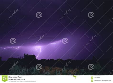 Bright Flash Of Lightning Illuminated The Night Sky And