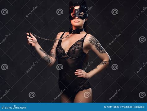 Woman Wearing Black Lingerie In Bdsm Cat Leather Mask And Accessories