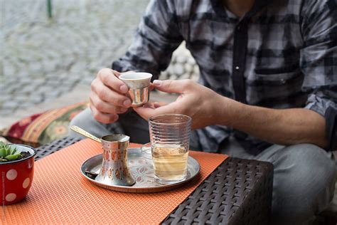 Man Drinking Turkish Coffee From A Cute Tea Cup By Stocksy