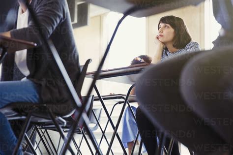 Female College Student Listening Classroom Stock Photo
