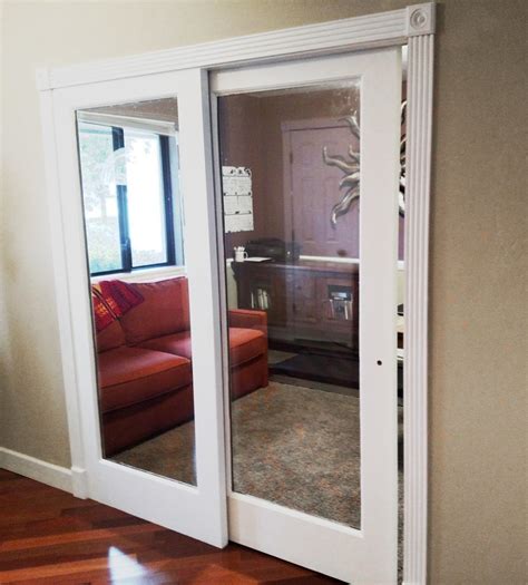 This bypass configuration is more convenient in spaces where a full sized sliding barn door won't fit, or when you want to be able to open half of the door. Interior sliding French door and one fixed panel.