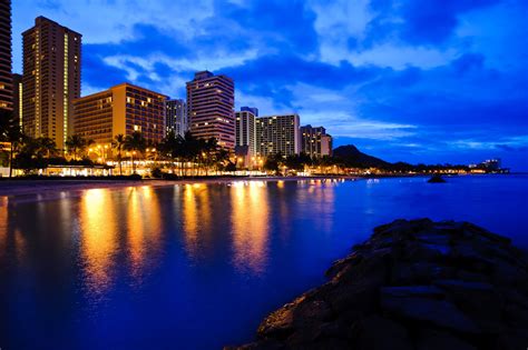 A Beautiful Nighttime Scene Of Waikiki Beach Learn About Our Clean