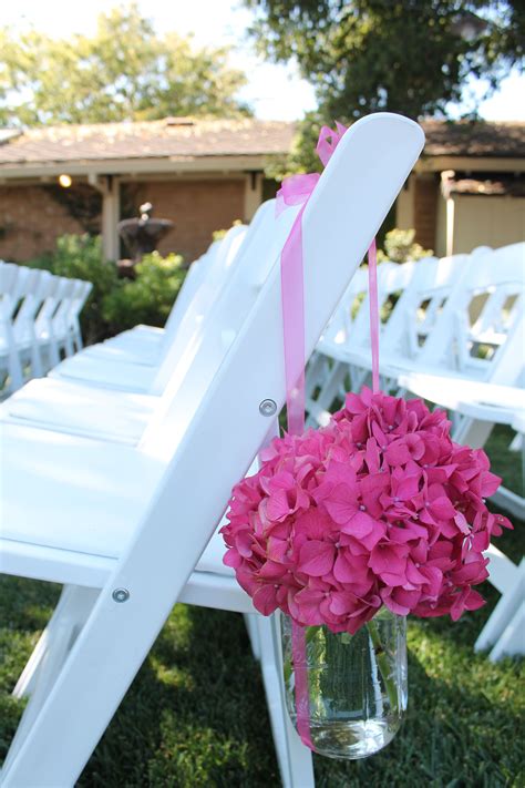 Here at weddingchairs.net, we see things a little differently. Chair flower. | Aisle flowers, Hot pink flowers, Wedding ...