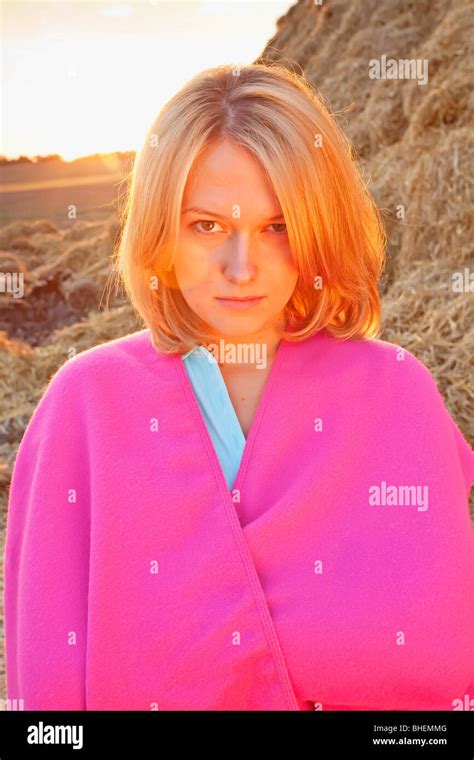 Young Woman Against Hay Bale Stock Photo Alamy