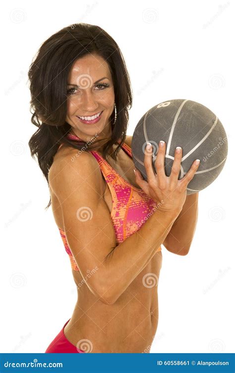 woman in pink sports outfit medicine ball in hands stock image image of exercise female 60558661