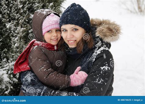Mother And Daughter Enjoying Snowy Weather Stock Image Image Of