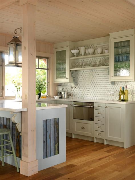 When planning a new kitchen or major remodel, a key decision you'll need to make is whether to run the upper wall cabinetry all the way to the ceiling or to install cabinets with a gap above them. Cottage Kitchen With Beadboard Ceiling and Green Cabinets ...