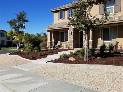 A Residential Front Yard Landscape With Low Water Plantings Gravel