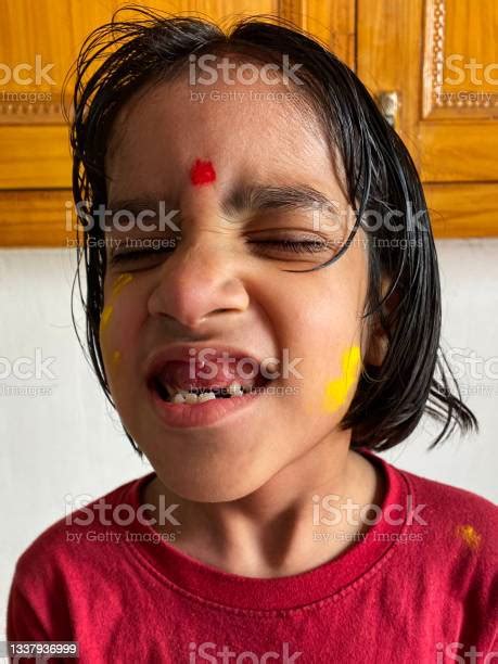 Image Of Face Of Young Indian Girl Showing Off The Loss Of Her Front