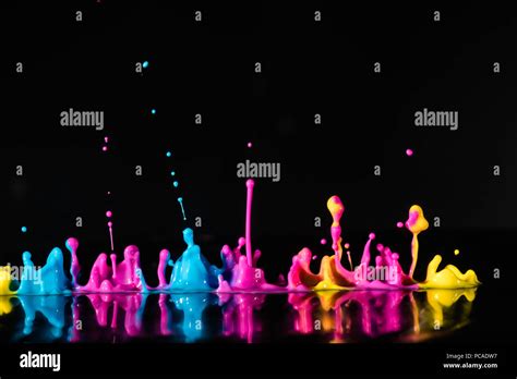 Abstract Sculptures Of Colorful Splashes Of Paint Dancing Liquid On A