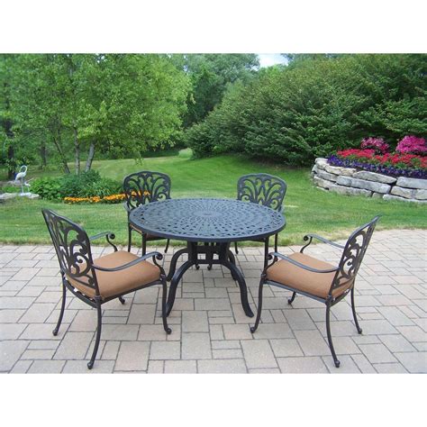 The materials are chosen with great care for the outdoor furniture, the materials which has high durability, and high resistant to weather are given preference in such cases. Oakland Living Hampton 5-Piece Patio Dining Set with ...