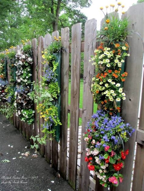 Overflowing Blossoms In Fence Hanging Planters Design And Construction