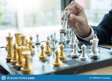 Businessman Playing Chess Figure Take A Checkmate Another King With