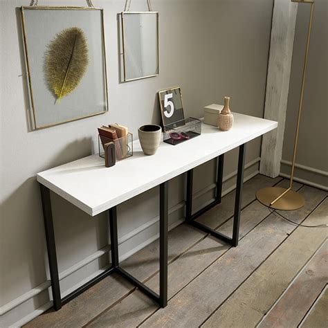 Grâce à cette console extensible disponible en coloris chêne clair, blanc, bois vintage, noir ou encore wengé. Table console extensible en mélaminé - Flap | 4-pieds.com