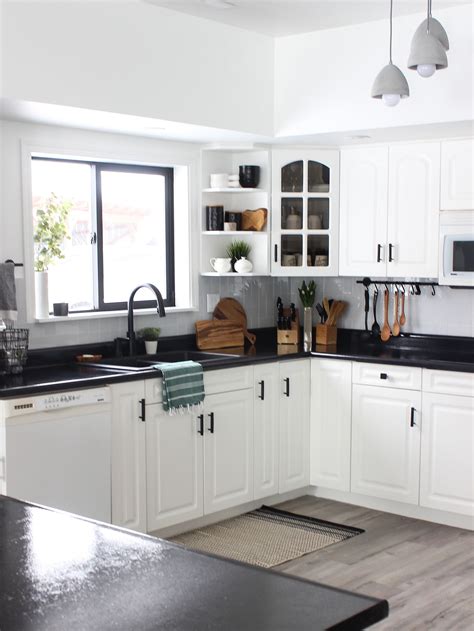 See more ideas about kitchen design, kitchen remodel, kitchen pictures. White Kitchen Cabinets with Black Countertops Are the Next ...